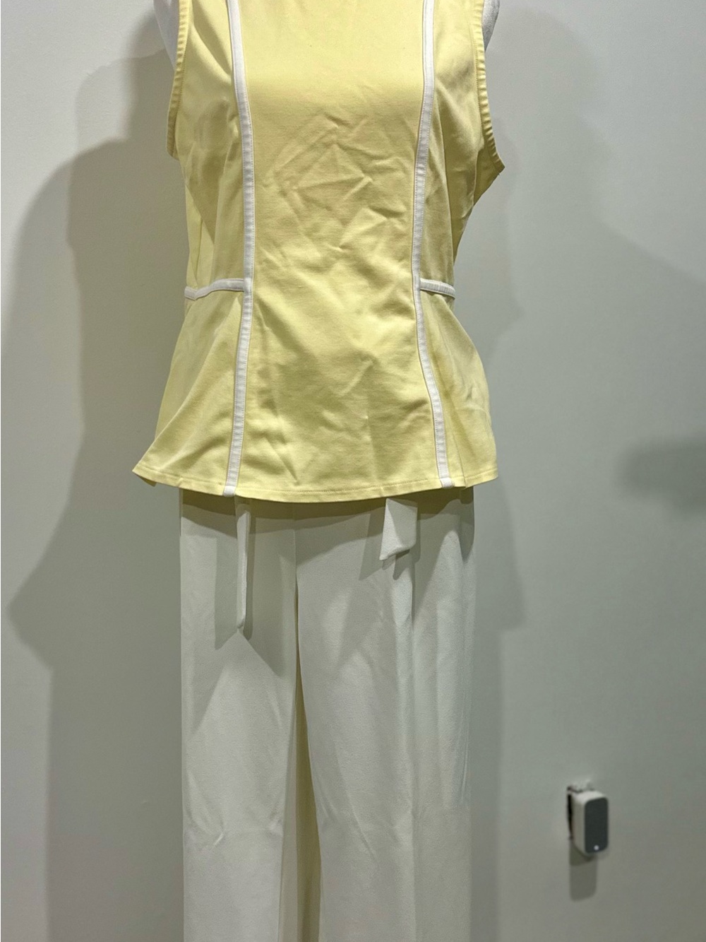 Yellow Sleeveless Peplum Top with White Piping pants